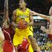 Michigan sophomore Trey Burke attempts to shoot through  North Carolina State defense during the second half at Crisler Center on Tuesday night. Melanie Maxwell I AnnArbor.com